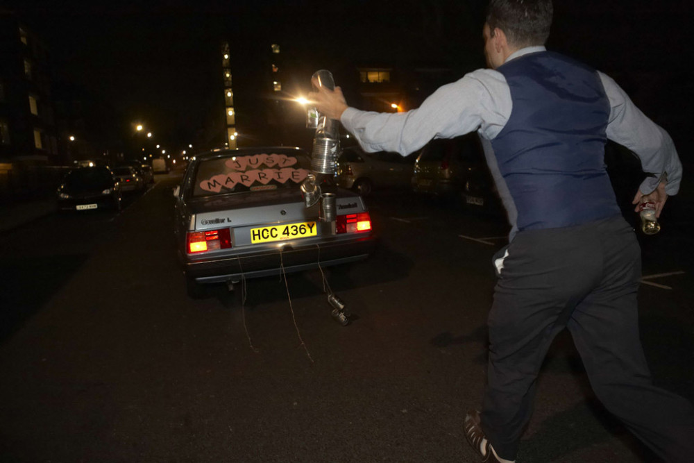 Darren, aged 9, chases the loaned Vauxhall Astra cos the cans fell off